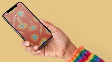 Hand holding iPhone
